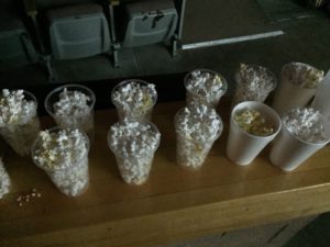 Plastic cups filled with popcorn