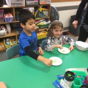 Kindergarten students eating green eggs and ham