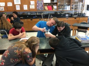 Students do a water filtration activity