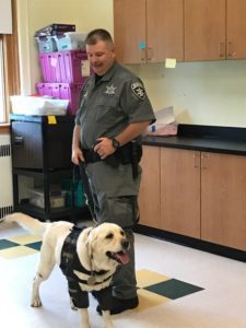 Officer Davendonis and his four-legged partner Inferno, a Yellow Lab